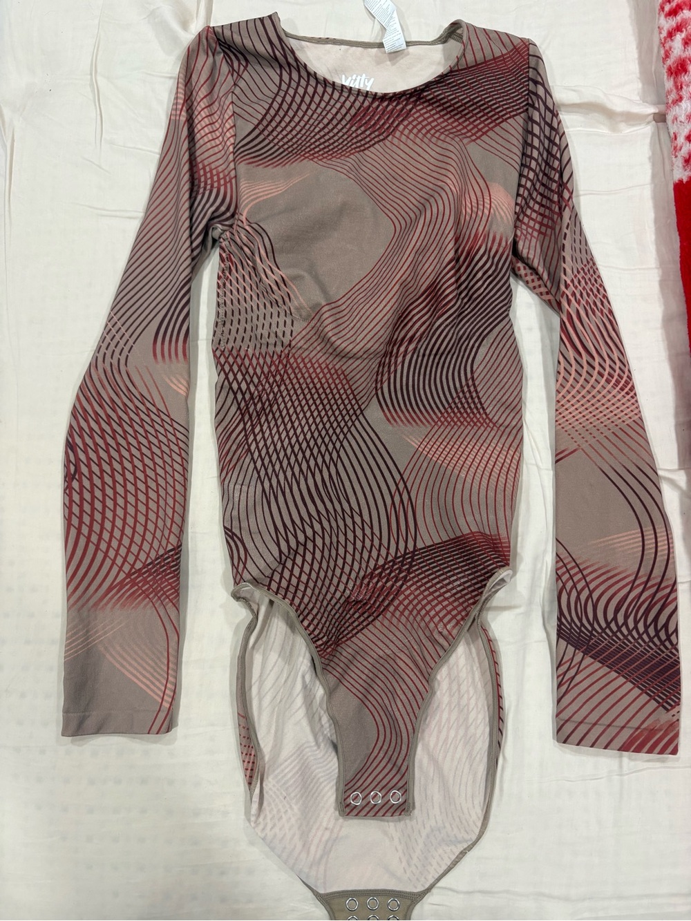 YITTY Long-Sleeve One-Piece Bodysuit in Taupe with Red Wave Print